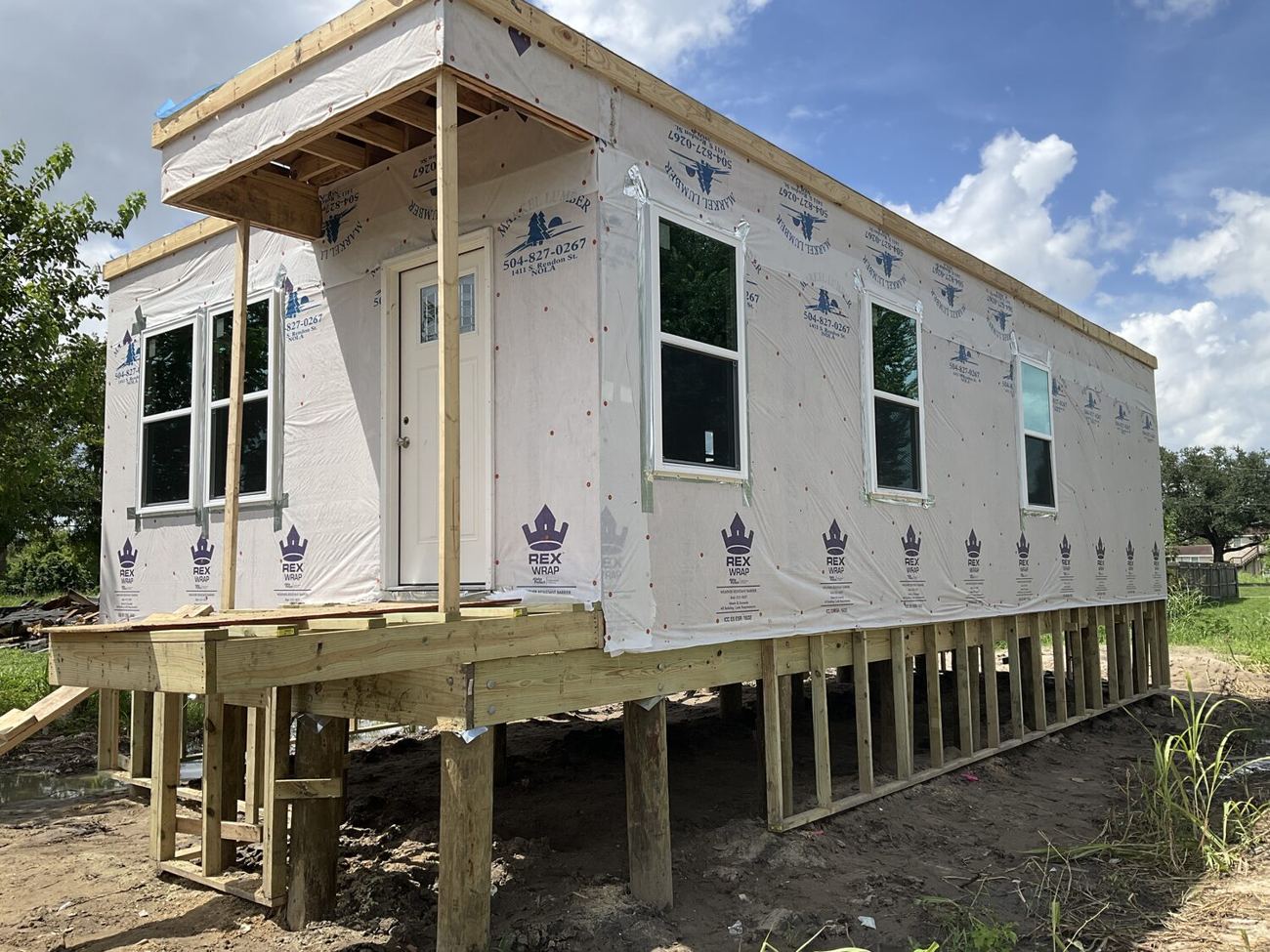 Home enclosed and sheathed on pilings